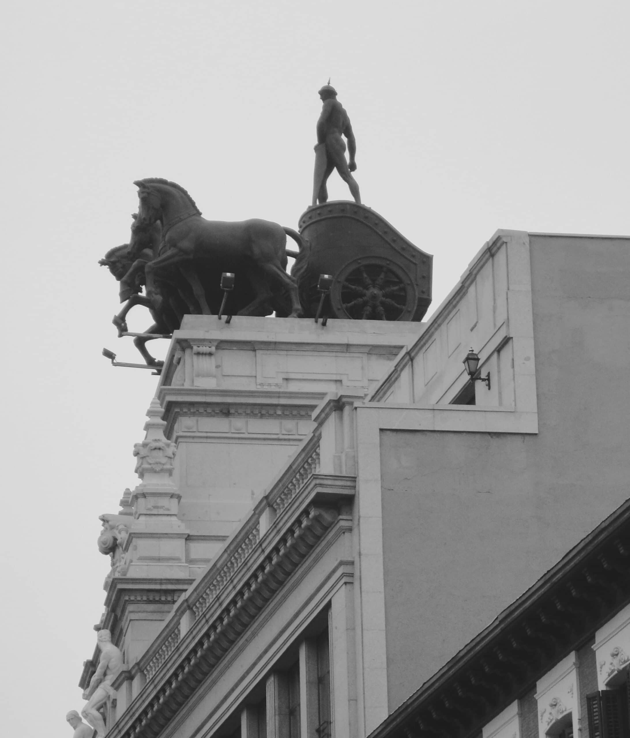 Madrid horses pulling a chariot on a Madrid roof